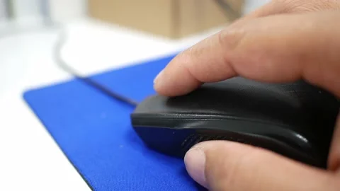 Hand close up of office man hand clicking on mouse and typing on a keyboard Stock Footage 149591748