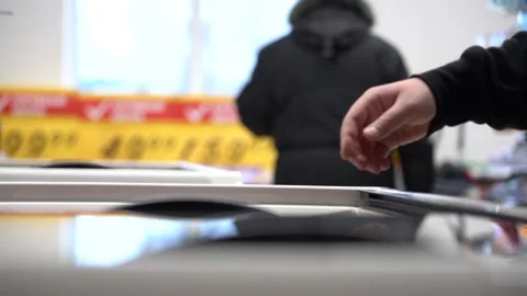 Hand in close-up opens the freezer in the store and takes the frozen product Stock Footage 155531105