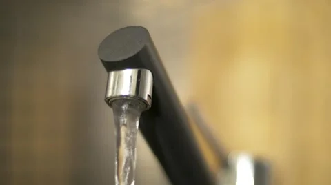 Hand close a running water tap faucet in the kitchen Stock Footage 59139837