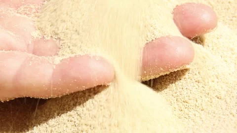 Hand close-up on the sand. Sand is pouring into my hand. Stock Footage 245427980