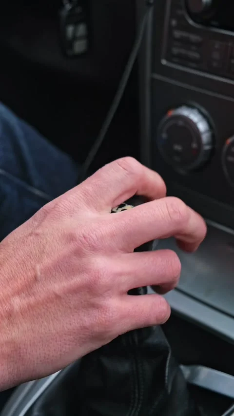 Hand close up switching gear driving the car Stock Footage 245148404