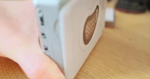 Hand closes the deck with a cassette and presses the play button. Close-up 動画素材 266778322