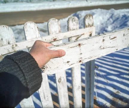 Hand closes gate Photos