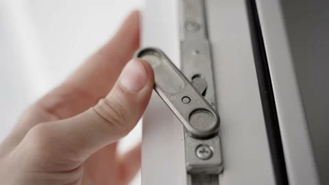 The hand closes the second leaf of plastic doors and blocks the lock, close-up Stock Footage 239711976