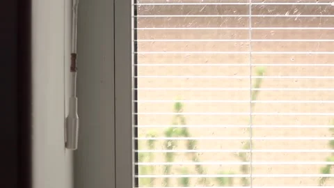 Hand closes the window blinds Video stock 130663650