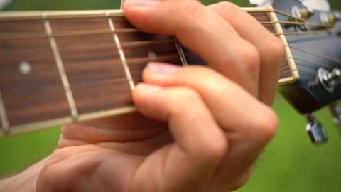 Hand closeup of a man playing acousic guitar, finger closeup. Stock Footage 123413761
