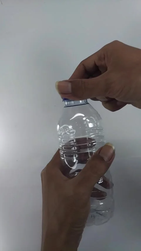 Hand closing bottle cap4 Stock Footage 329156715