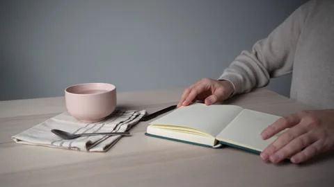Hand Closing Notebook on Desk at Home Workspace Video stock 328003206