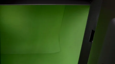 The hand is closing the safe box , which has a green background inside. 库存影片 118139821