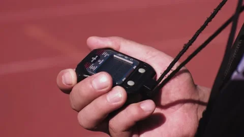 Hand of A Coach Holding A Timer Stock Footage 168505901