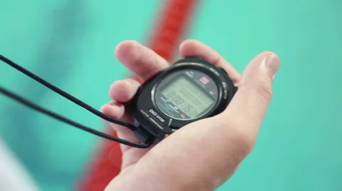 Hand of coach with a stopwatch Stock Footage 57363829