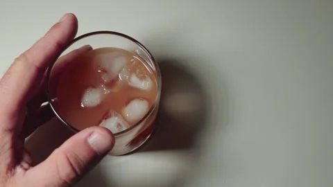 Hand on cocktail Contemplating a Drink Stock Footage 318773645