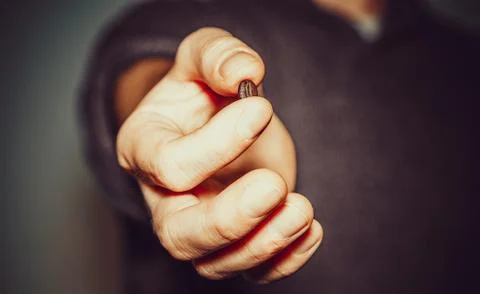 Hand with coffee bean Stock Photos