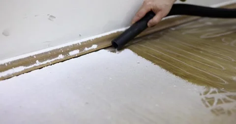 Hand collects construction dust with a vacuum cleaner Stock Footage 271203097