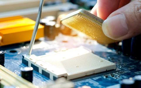 Hand of computer engineering brings computer cpu processor memory change comp Stock Photos