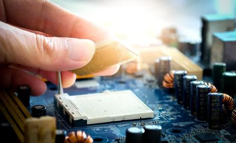 Hand of computer engineering brings computer cpu processor memory change comp Stock Photos