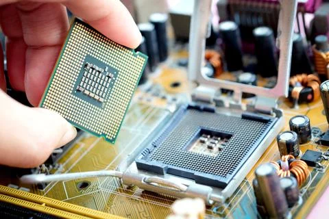 Hand of computer engineering brings computer cpu processor memory change comp 写真素材
