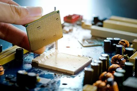 Hand of computer engineering brings computer cpu processor memory change comp Stock Photos