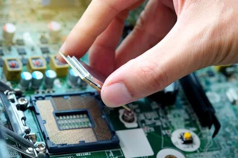 Hand of computer engineering brings computer cpu processor memory change comp 写真素材