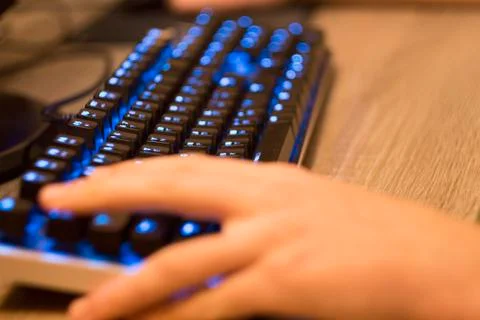 Hand on computer keyboard Stock Photos