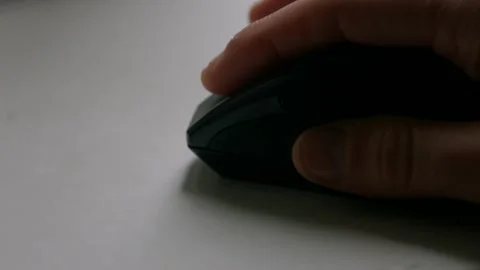 Hand on Computer Mouse Clicking and Scrolling Doing Office Work on White Stock Footage 242986857