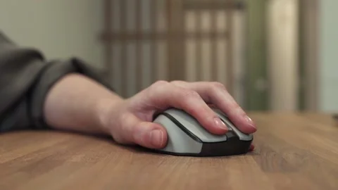 Hand on computer mouse, finger pressing key, left button, double click for Stock Footage 232260838