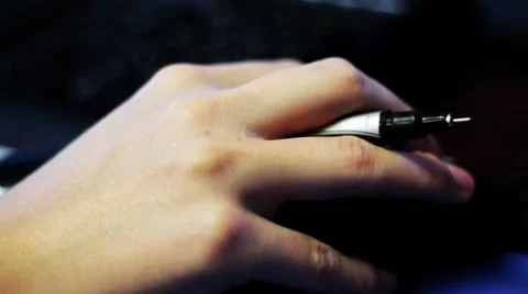 Hand on computer mouse hard light Stock Footage 8360193