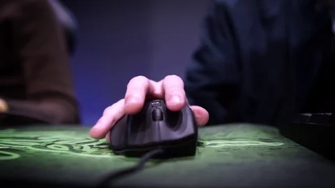 Hand on computer mouse playing video game - Esports / eSports Stock Footage 73623973