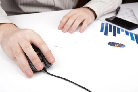 Hand on a computer mouse at work Stock Photos