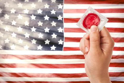 Hand with condom Stock Photos