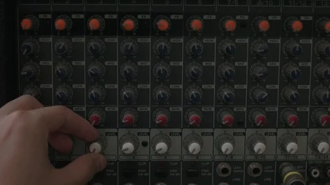 Hand configured many knobs on analog mixer Stock Footage 87910883
