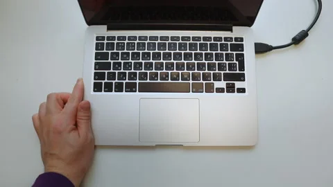 Hand connect wires to laptop Stock Footage 150743471