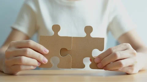 Hand connecting couple puzzle piece. Business Solving, mission, challenge, su Stock Footage 219721670