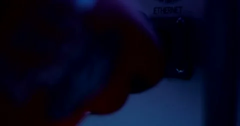Hand Connecting Network Cable into Ethernet Port on Test Device, Close Up Stock Footage 340359415