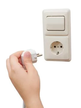 Hand connecting a plug to a socket Stock Photos