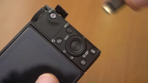 Hand connecting usb cable to digital camera- close up Stock Footage 96330473