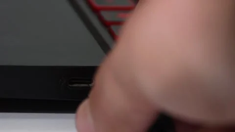 Hand connecting a USB cable to a PC, plugging device into computer USB port Stock Footage 305779644