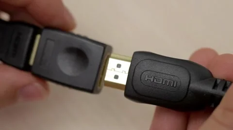 A hand connects HDMI cables Stock Footage 54354423