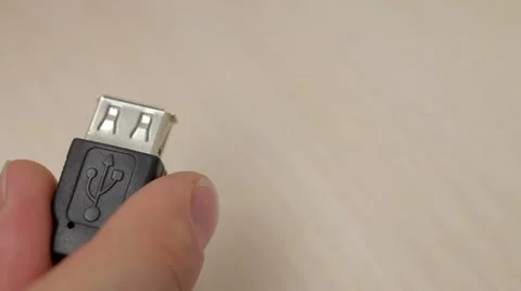 A hand connects USB cables Stock Footage 54354397