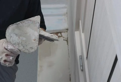 Hand construction tools in the process of plastering Stock Photos