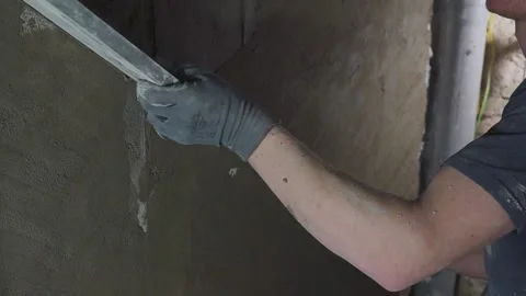 Hand of Construction worker is plastering wall and beam using cement plaster at 스톡 동영상 142611459