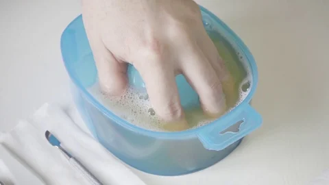Hand in the container for maceration Stock Footage 72980755