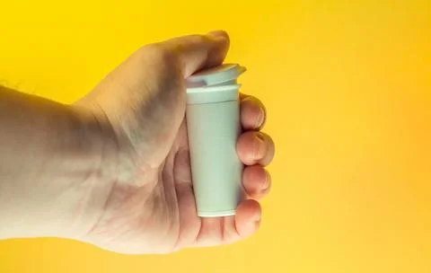 Hand with container Stock Photos