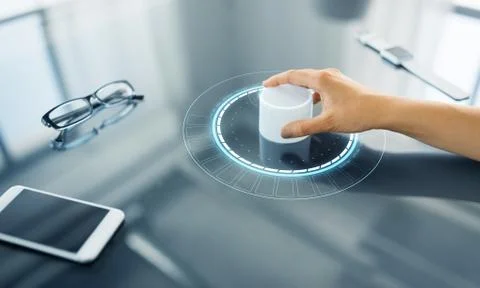 Hand with control knob on interactive panel Stock Photos