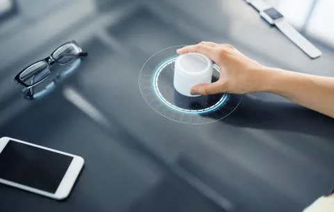 Hand with control knob on interactive panel Stock Photos