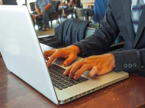 Hand control on a laptop touch Foto stock