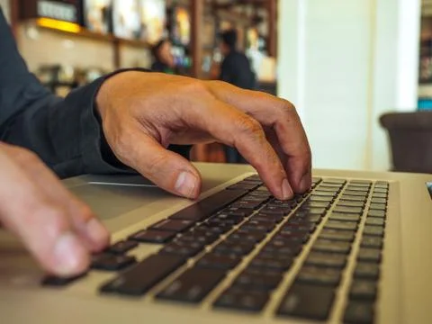 Hand control on a laptop touch Stock Photos