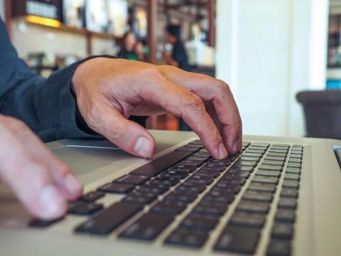 Hand control on a laptop touch Stock Photos
