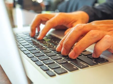 Hand control on a laptop touch Stock Photos