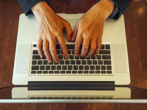 Hand control on a laptop touch Stock Photos